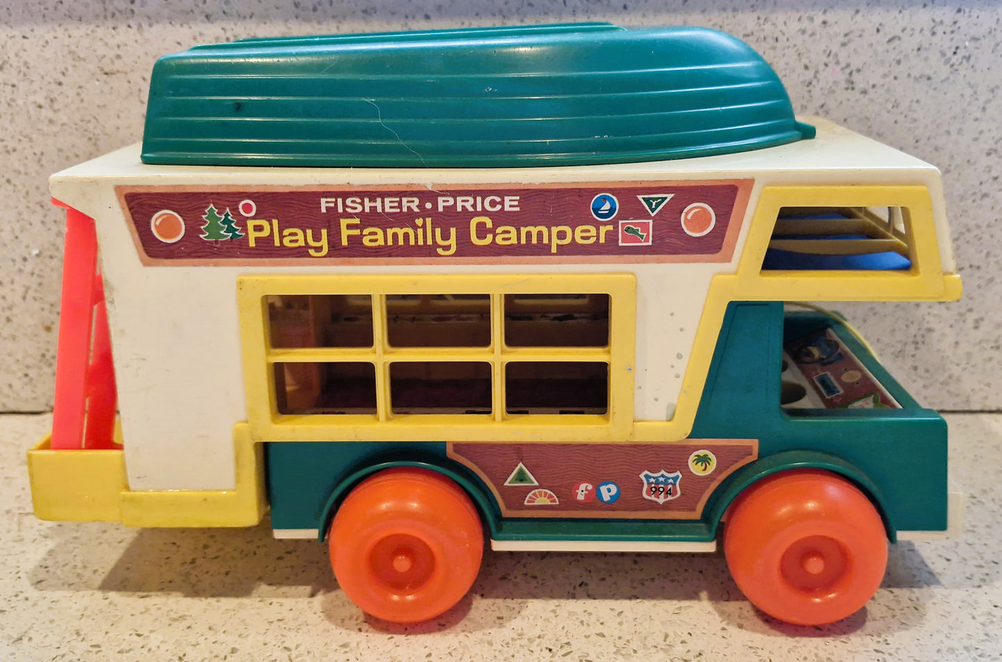 Vintage Fisher-Price Play Family Camper toy on a neutral background